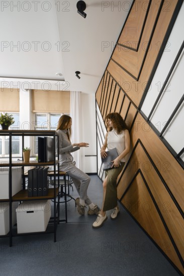 Two women stayed up late discussing their app for monitoring women's health in a startup office space