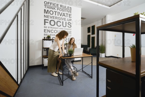 Two young women rejoice at the successful launch of their health program project