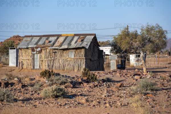 Simple house made of wood and clay in a small village, Erongo, Damaraland, Namibia
