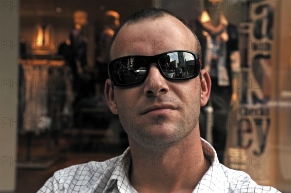 Young man with sunglasses, Freiburg im Breisgau, Baden-Württemberg, Germany