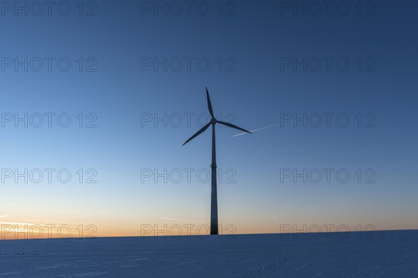 Wind turbine in winter in the evening sky, Karsberg, Upper Franconia, Bavaria, Germany