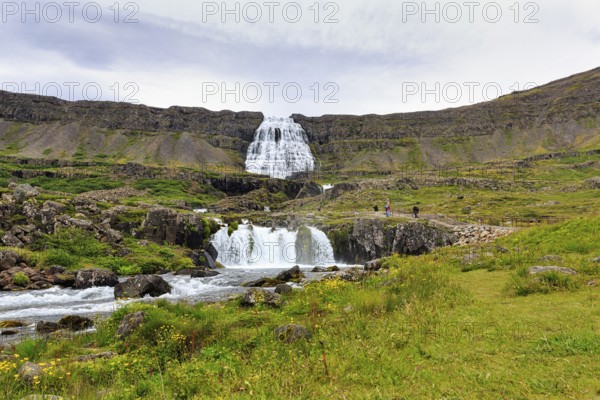 Dynjandi, Dynjandifoss or Fjallfoss, tourists, hikers at the waterfall in summer, river Dynjandisá, Vestfirðir, Westfjords, Iceland