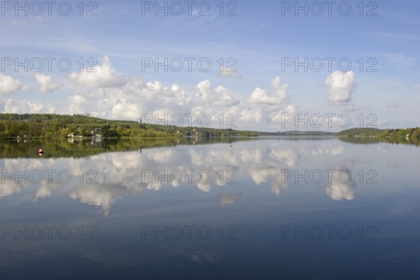 View over the Möhnesee, Möhnesee tower, red and white buoy, blue cloudy sky, reflection on the water surface, Möhnetalsperre, North Rhine-Westphalia, Germany