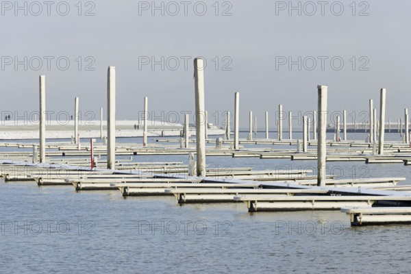 Winter day, onset of winter, snow on the jetties in the marina, North Sea, Norddeich, Lower Saxony, Germany