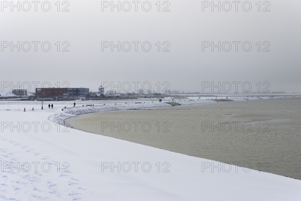 Winter day, onset of winter, snow on the North Sea coast, snow-covered beach promenade of Norddeich, Lower Saxony, Germany