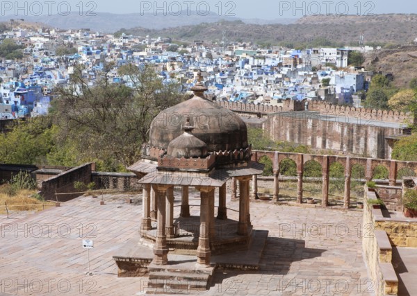 Pagoda in the Mehrangarh or Meherangarh fortress, behind the blue houses of Jodhpur, Rajasthan, India
