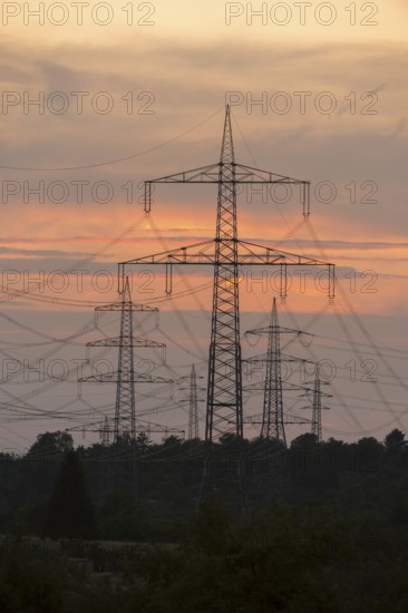 Sunset with numerous electricity pylons and a calm, dramatic atmosphere, Waiblingen, Baden-Württemberg, Germany