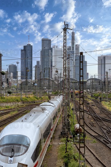 Bridge at Camberger Straße, Galluswarte, Deutsche Bahn, tracks and trains with the skyline of Frankfurt am Main, Hesse, Germany
