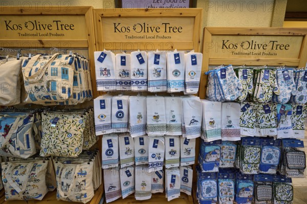 Ifestou alley, shelves with souvenir towels, decorated with local patterns and designs, Kos town, Kos, Dodecanese, Greek Islands, Greece