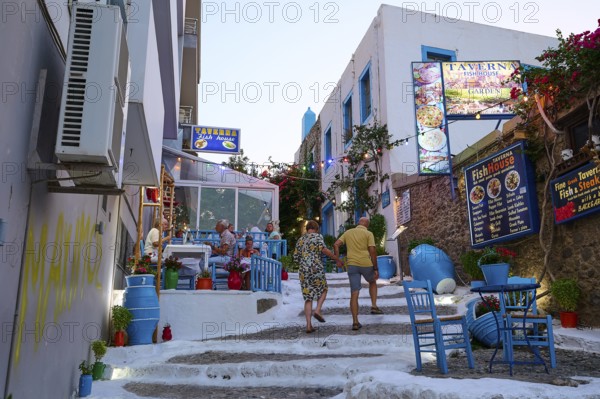 Riga Fereou, Steps of Kos, famous alley, picturesque alleyway with tavernas, colourful chairs and cosy ambience in the evening light, Kos Town, Kos, Dodecanese, Greek Islands, Greece