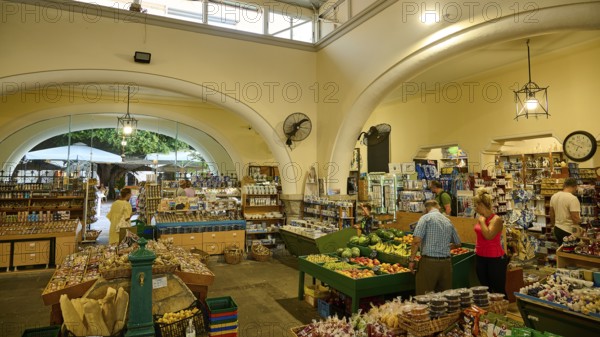 Agora, Municipal market hall, Inner market area with food shops and arches, lively with visitors, Kos Town, Kos, Dodecanese, Greek Islands, Greece