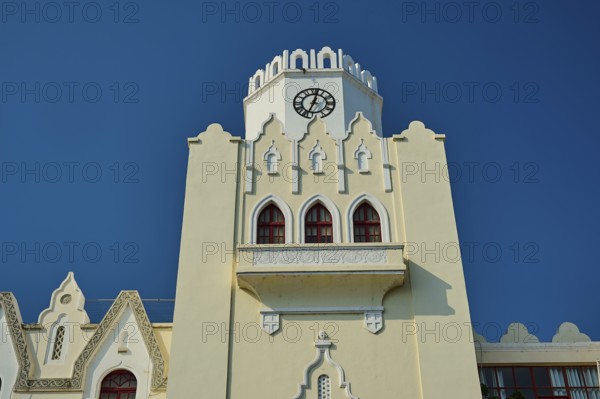 Palace of Justice, colonial building, close-up of a white clock tower with gothic arches against a blue sky, Kos Town, Kos, Dodecanese, Greek Islands, Greece