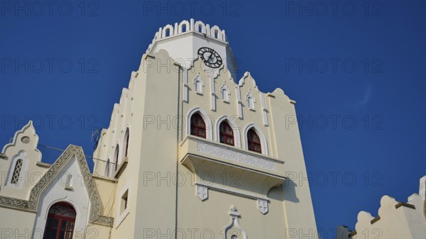 Palace of Justice, colonial building, Gothic-style bell tower with clock and battlements under a clear blue sky, Kos Town, Kos, Dodecanese, Greek Islands, Greece
