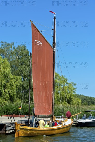 Zeesenboot casting off in Krummin natural harbour, Usedom Island, Mecklenburg-Western Pomerania, Germany