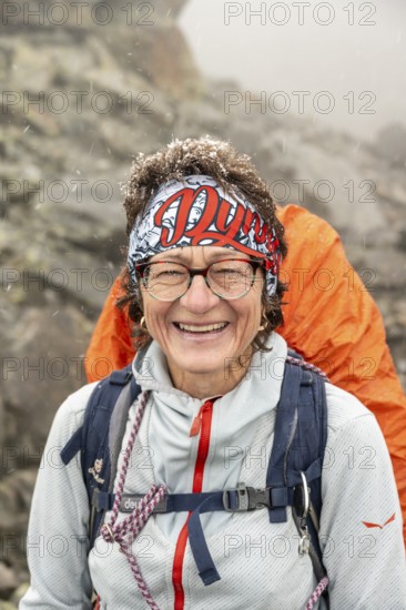 Laughing woman, portrait, mountaineer with snow in her hair, Hornscharte, Wiener Höhenweg, Schober group, Hohe Tauern National Park, Carinthia, Austria