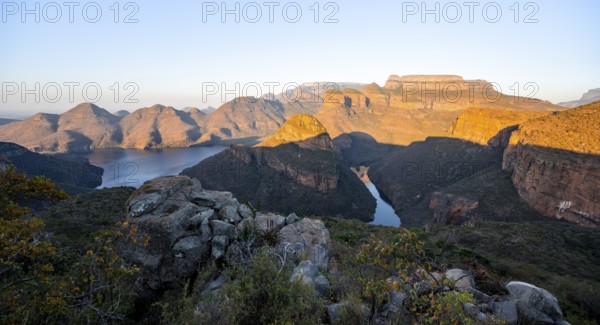 Sunset at Blyde River Canyon with Three Rondawels peak, view of canyon with Blyde River and table mountains in the evening light, canyon landscape, Panorama Route, Mpumalanga, South Africa