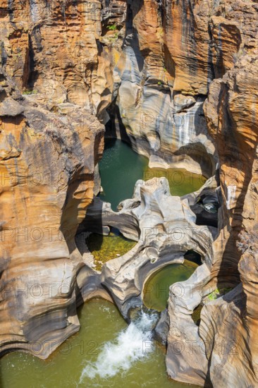 Eroded rock formations, canyon with steep orange-coloured rock cliffs with the Blyde River, Bourke's Luck Potholes, Panorama Route, Mpumalanga, South Africa