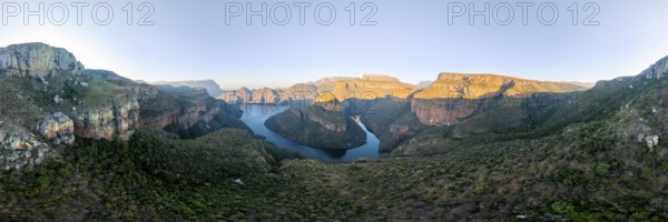 Panorama, sunset at Blyde River Canyon with Three Rondawels peak, view of canyon with Blyde River and table mountains in the evening light, canyon landscape, Panorama Route, Mpumalanga, South Africa