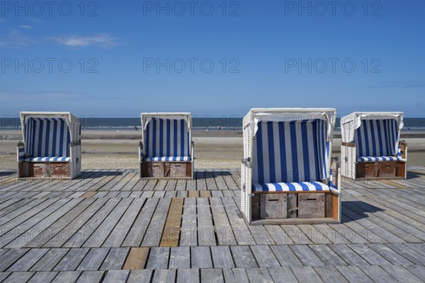 Beach chairs on wooden planks, Sankt Peter Ording, Eiderstedt, North Frisia, North Sea, Schleswig-Holstein, Germany