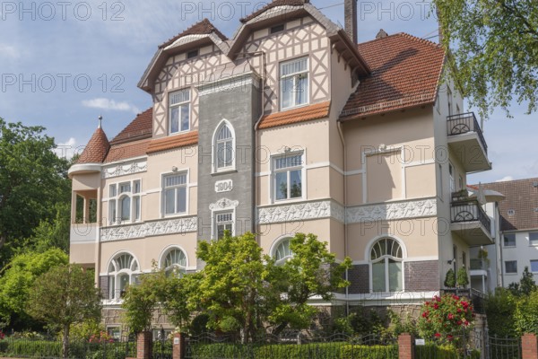 Living in the Schwachhausen district, façade of a Wilhelminian style villa, year 1904, architecture, half-timbered upper storey, corner tower, gardens, Hanseatic city of Bremen, Germany
