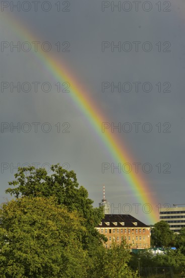 Rainbow over the city of Augsburg, in the centre of the picture the hotel tower, Augsburg, Bavaria, Germany