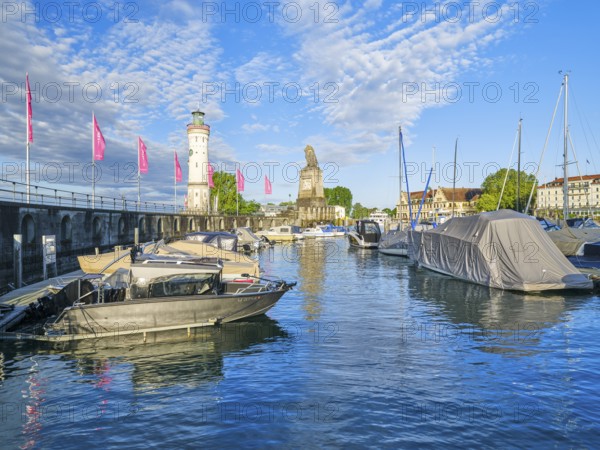 Harbour with lighthouse and lion statue in Lindau, Lake Constance, lake, blue sky, morning, boats, Lindau, Swabia, Bavaria, Germany