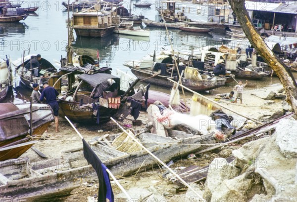 People living on sampan boats in the harbour thought to be at Causeway Bay, Hong Kong, Asia 1964