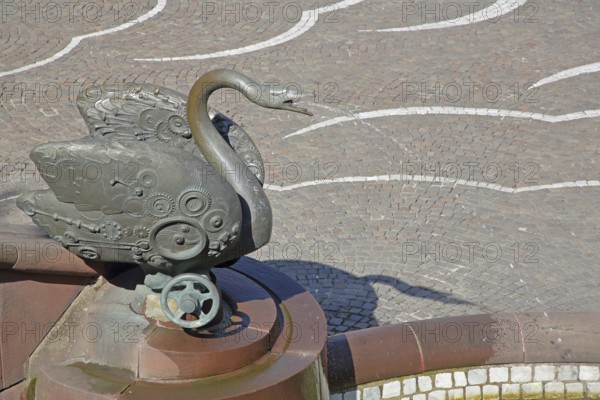 Castle fountain with swan figure by Gernot Rumpf 1984, water jet, bronze sculpture, modern art, detail, reliefs, hand wheel, swan neck, fountain, Schlossplatz, Pirmasens, Rhineland-Palatinate, Germany