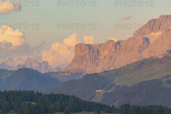 Dramatic mountain range with clouds in the evening light, Alpe di Siusi, Dolomites, South Tyrol, Italy