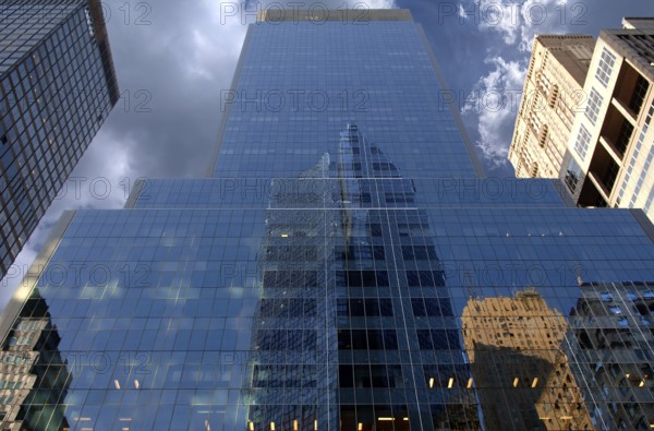 Reflection in a glass facade of a skyscraper, New York City, USA