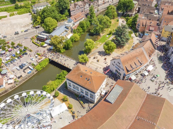 Aerial view of a summer festival with Ferris wheel, river, bridge and park, surrounded by municipal buildings, 950 years of Calw, Calw parade, Black Forest, Germany