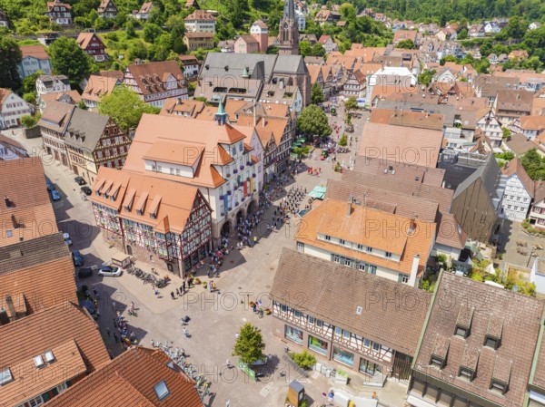 Aerial view of a colourful half-timbered town with a lively market square and church on a summer's day, 950 years of Calw, Calw parade, Black Forest, Germany