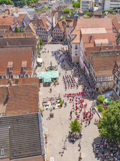 Aerial view of an old town with half-timbered houses and a gathering of people, 950 years of Calw, Calw parade, Black Forest, Germany