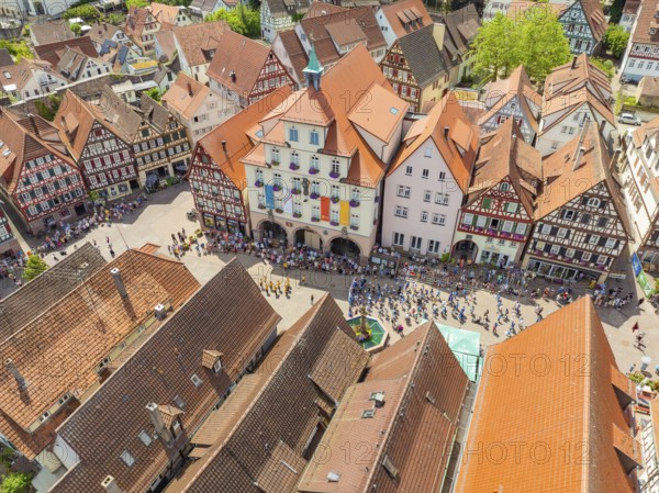 People on a square surrounded by half-timbered houses at a festival, summer day, 950 years Calw, parade Calw, Black Forest, Germany