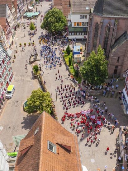 Aerial view of a celebration in a historic town with half-timbered architecture and many people, 950 years of Calw, Calw parade, Black Forest, Germany