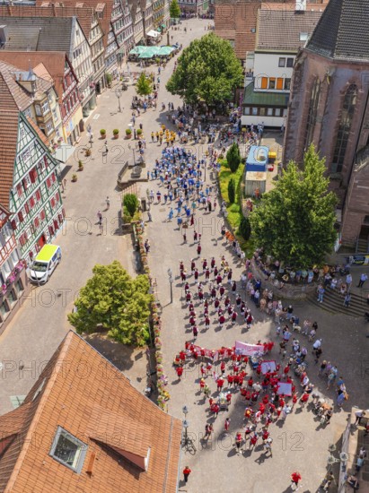 Large crowd at a street festival, surrounded by half-timbered architecture and summer weather, 950 years of Calw, Calw parade, Black Forest, Germany