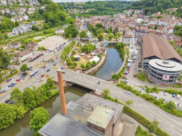 Aerial view of a town in rural surroundings with river, bridge and dominant buildings, 950 years of Calw, Calw parade, Black Forest, Germany