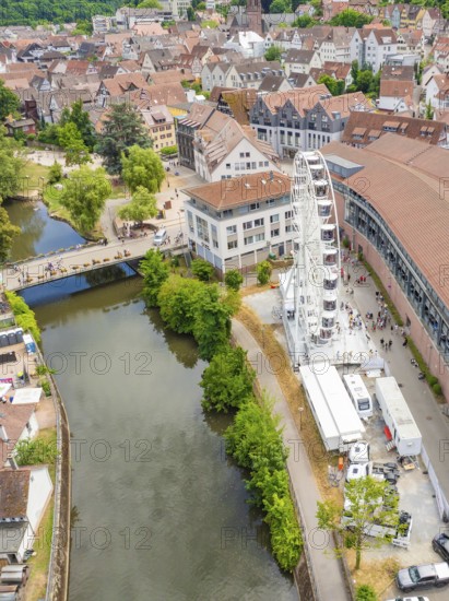 Aerial view of a town with a river, Ferris wheel and surrounding buildings, surrounded by greenery, 950 years of Calw, Calw parade, Black Forest, Germany