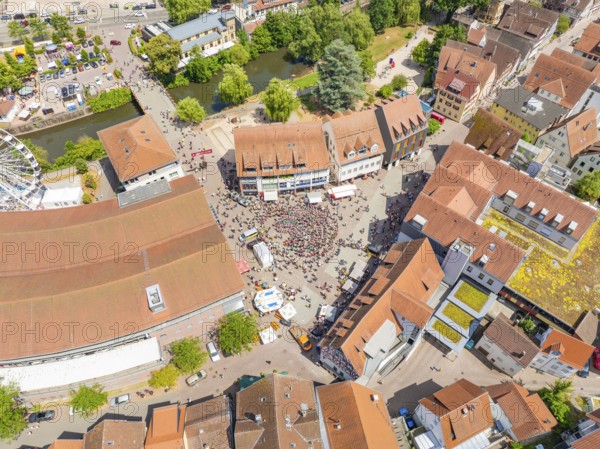 Aerial view of a town with a lively market square, numerous buildings and green trees, 950 years of Calw, Calw parade, Black Forest, Germany