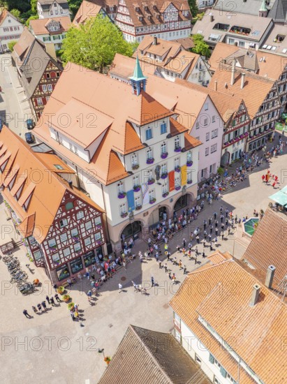 Crowds of people at an event in a central city area with historic buildings, 950 years of Calw, Calw parade, Black Forest, Germany