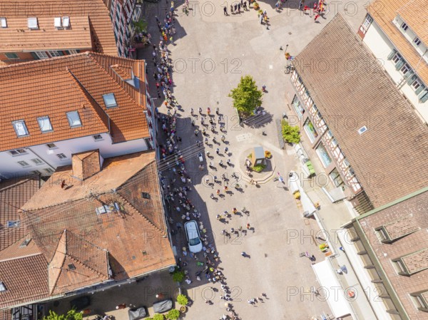 People on a square next to several historic buildings, 950 years of Calw, Calw parade, Black Forest, Germany