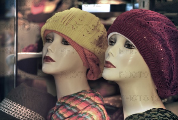 Female mannequins with knitted hats, New York City, USA