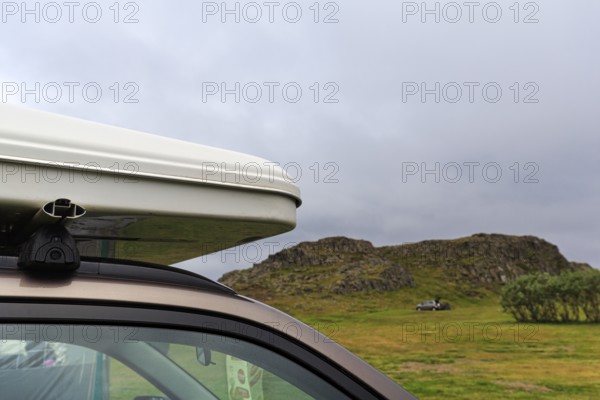 Rooftop tent on car roof in volcanic landscape, detail, camping site, rain clouds, Bakkagerdi, Bakkagerði, Borgarfjördur eystri, East Iceland, Austurland, Iceland