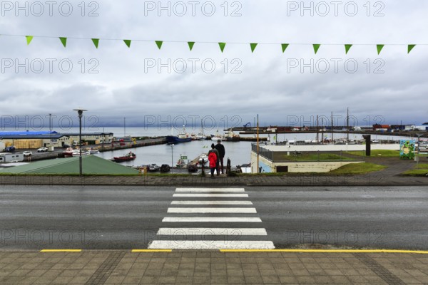 View of the harbour, fishing village at Skjalfandi Bay, rain clouds, Husavik, Húsavík, North Iceland, Iceland