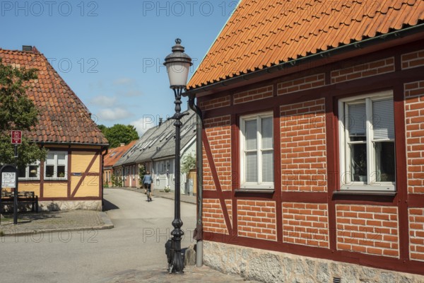 Small street with street lamp and half timbered house in Ystad, Skåne County, Sweden, Scandinavia