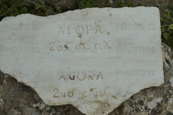 Inscribed ancient stone with inscription in various languages, Ancient Agora, Kos Town, Kos, Dodecanese, Greek Islands, Greece