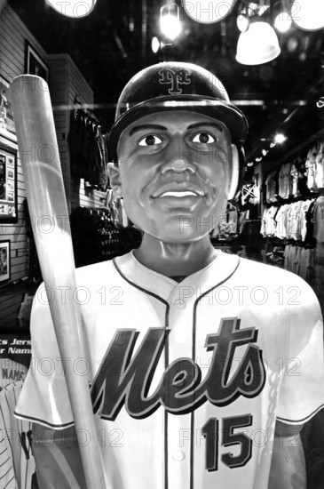 Baseball figure in a sports shop, black and white, New York City, USA