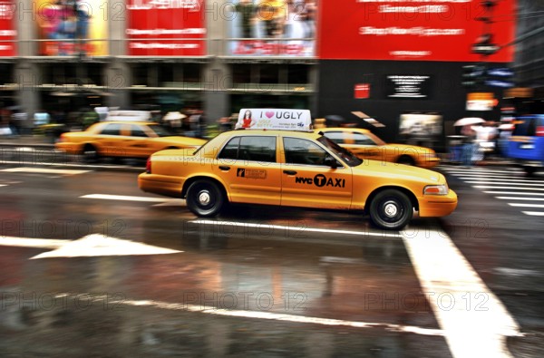 Yellow Caps, New York taxis in the rain, New York City, USA