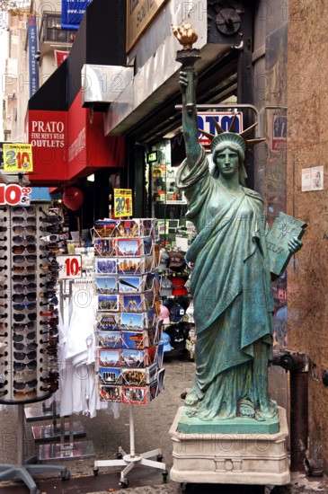 Souvenir shop with large Statue of Liberty, postcards and sunglasses, New York City, USA