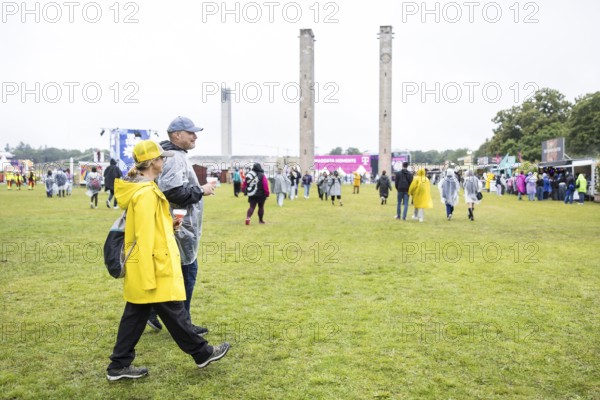 Two festival-goers with cocktail glasses at the Lollapalooza Festival in the Olympic Stadium and on the Maifeld, Berlin, 12 July 2025